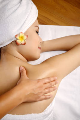 woman lying down receiving a massage